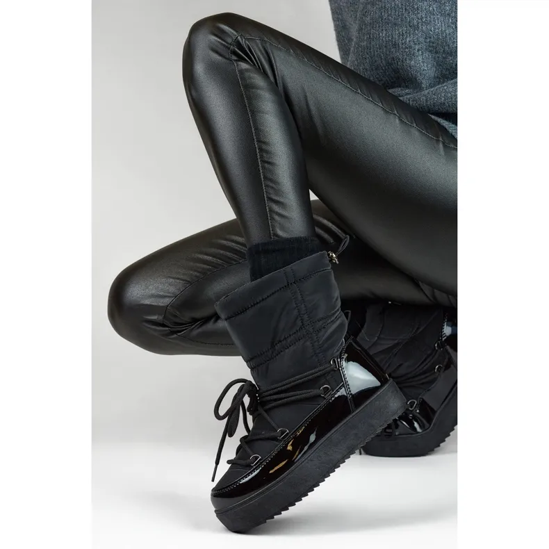 Black women's snow boots with a thick sole, winter shoes