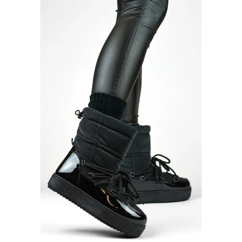 Black women's snow boots with a thick sole, winter shoes